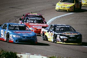 Johnny Sauter's Chevy Monte Carlo and (21) Kevin Cywinski's Chevy Monte Carlo battle