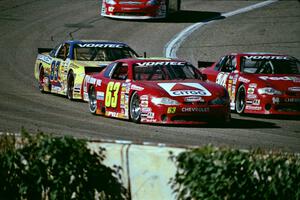 (14) Doug Mahlik's Chevy Monte Carlo, (63) Robbie Pyle's Chevy Monte Carlo and (83) Joey Clanton's Chevy Monte Carlo