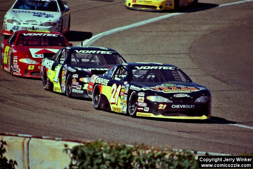 (21) Kevin Cywinski's Chevy Monte Carlo, (1) Mike Garvey's Chevy Monte Carlo and (63) Robbie Pyle's Chevy Monte Carlo