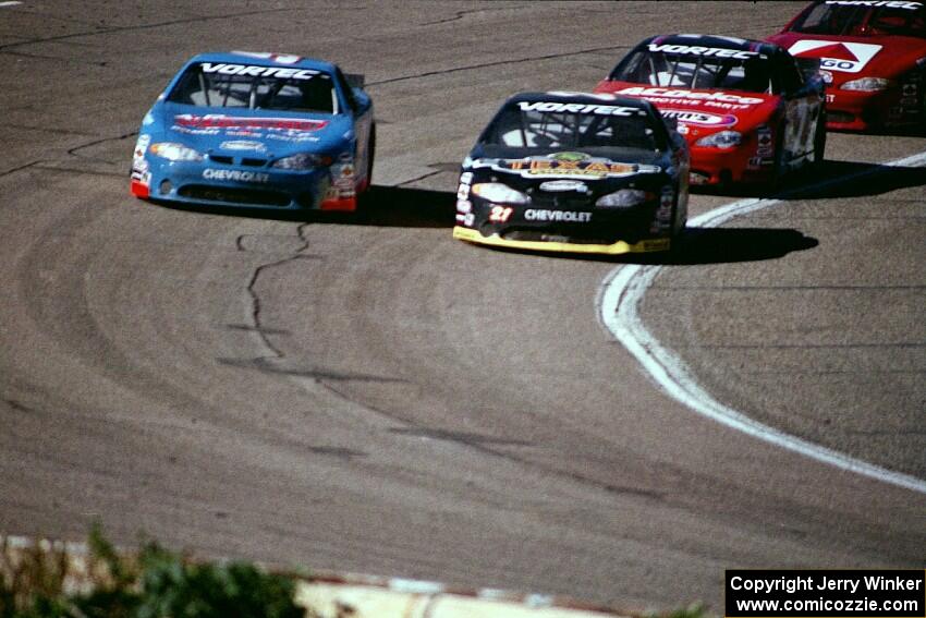 Johnny Sauter's Chevy Monte Carlo and (21) Kevin Cywinski's Chevy Monte Carlo battle