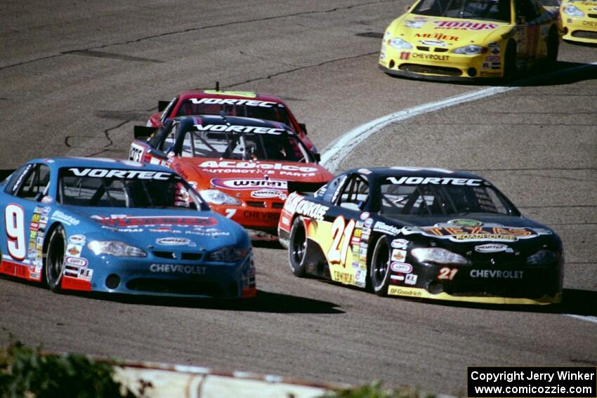 Johnny Sauter's Chevy Monte Carlo and (21) Kevin Cywinski's Chevy Monte Carlo battle
