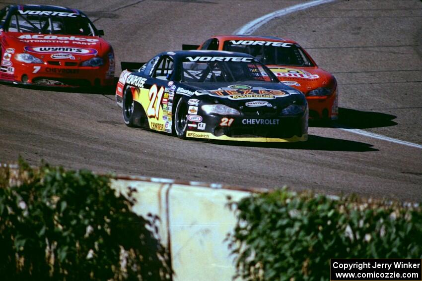 (21) Kevin Cywinski's Chevy Monte Carlo, (2) Chad Wood's Chevy Monte Carlo and Gary St. Amant's Chevy Monte Carlo