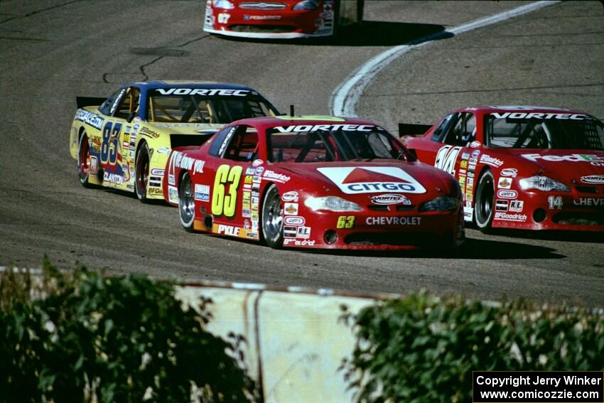 (14) Doug Mahlik's Chevy Monte Carlo, (63) Robbie Pyle's Chevy Monte Carlo and (83) Joey Clanton's Chevy Monte Carlo