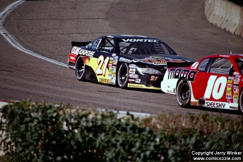 (10) Matt Sielsky's Chevy Monte Carlo and (21) Kevin Cywinski's Chevy Monte Carlo