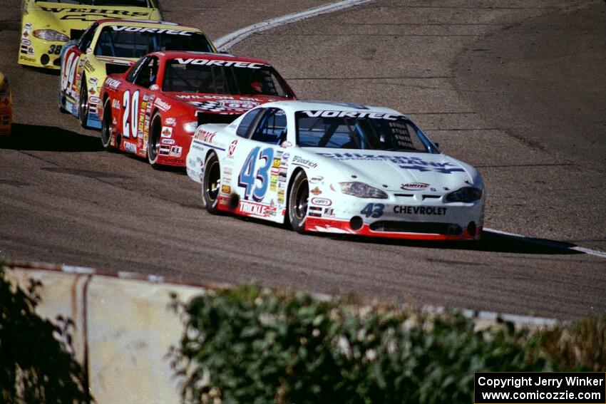 (43) Dick Trickle's Chevy Monte Carlo, (20) Steve Carlson's Chevy Monte Carlo and (94) Paul Paine's Pontiac Grand Prix