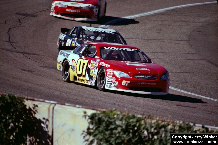 (07) Ted Smokstad's Ford Taurus and (52) Butch Miller's Chevy Monte Carlo