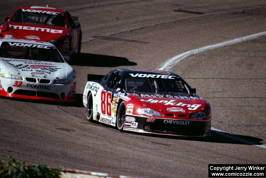 (86) Wayne Anderson's Chevy Monte Carlo, (33) Greg Stewart's Chevy Monte Carlo and (10) Matt Sielsky's Chevy Monte Carlo