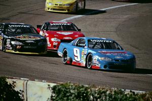 (9) Johnny Sauter's Chevy Monte Carlo, (21) Kevin Cywinski's Chevy Monte Carlo and (08) John Silverthorne's Chevy Monte Carlo