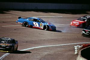 Johnny Sauter's Chevy Monte Carlo spins in front of Gary St. Amant's Chevy Monte Carlo
