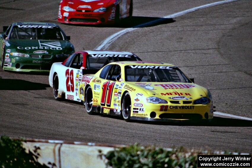 (11) Mike Eddy's Chevy Monte Carlo, (29) Francesco Gaudesi's Chevy Monte Carlo and (16) Russ Tuttle's Pontiac Grand Prix