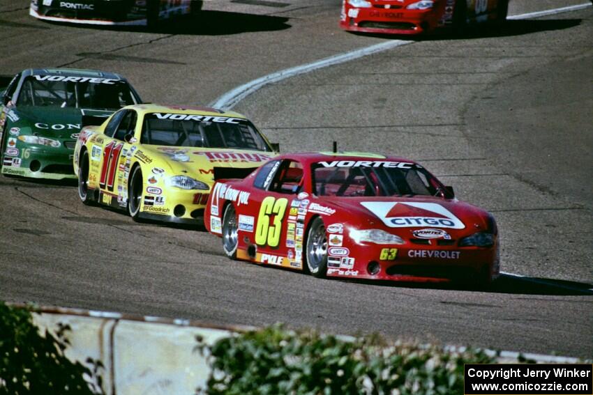 (63) Robbie Pyle's Chevy Monte Carlo, (11) Mike Eddy's Chevy Monte Carlo and (16) Russ Tuttle's Pontiac Grand Prix