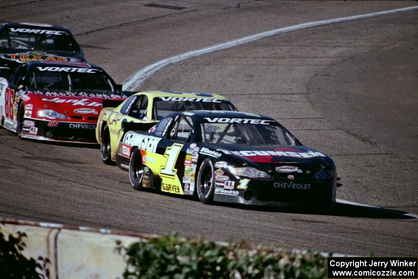 (1) Mike Garvey's Chevy Monte Carlo, (38) Johnny Spaw's Chevy Monte Carlo and (86) Wayne Anderson's Chevy Monte Carlo