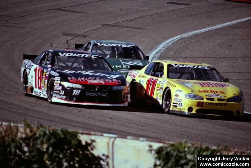 (11) Mike Eddy's Chevy Monte Carlo, (18) Mike Miller's Pontiac Grand Prix and (16) Russ Tuttle's Pontiac Grand Prix