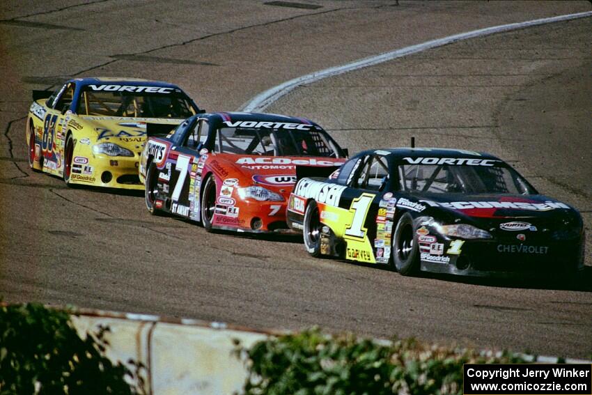 (1) Mike Garvey's Chevy Monte Carlo, (7) Gary St. Amant's Chevy Monte Carlo and (83) Joey Clanton's Chevy Monte Carlo