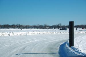 A view of the track from inside of an iceracing car.