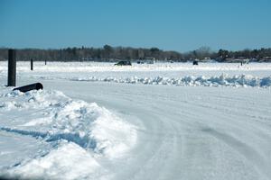 A view of the track from inside of an iceracing car.