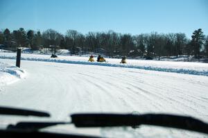 A view of the track from inside of an iceracing car.