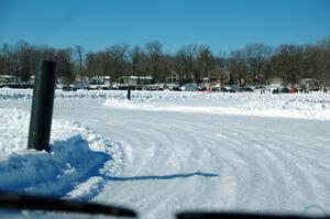 A view of the track from inside of an iceracing car.