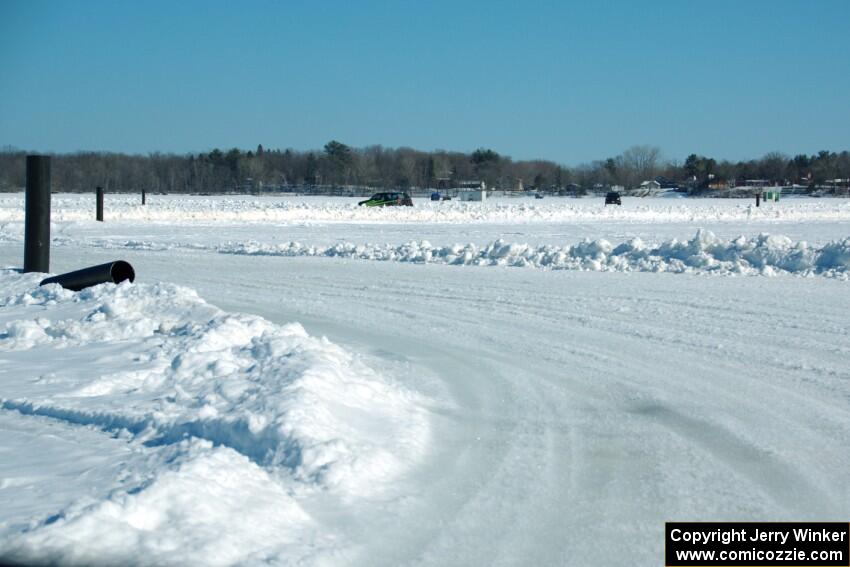 A view of the track from inside of an iceracing car.