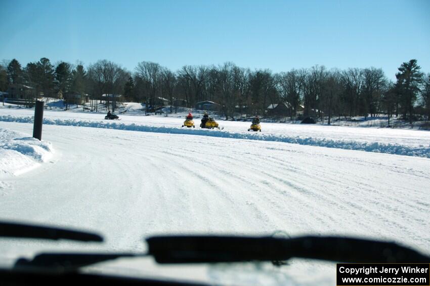 A view of the track from inside of an iceracing car.