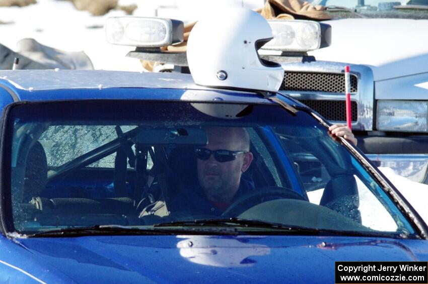 Mark Utecht sits in his Honda Civic prior to a sprint race.