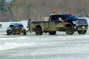 One of the Texas Drift Academy's Nissan 350Zs gets pulled from a snowbank.