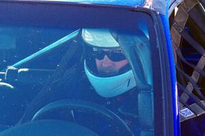 Mark Utecht sits in his Honda Civic prior to a sprint race.