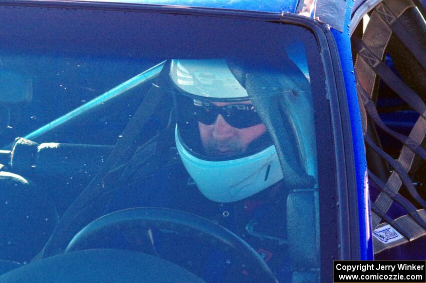 Mark Utecht sits in his Honda Civic prior to a sprint race.