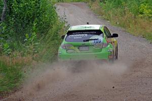 Lauchlin O'Sullivan / Scott Putnam Subaru WRX STi through a sharp left on SS3, Steamboat I.