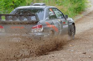 Sam Albert / Michelle Miller Subaru WRX STi at a sharp left on SS3, Steamboat I.