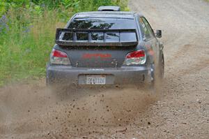 Sam Albert / Michelle Miller Subaru WRX STi at a sharp left on SS3, Steamboat I.