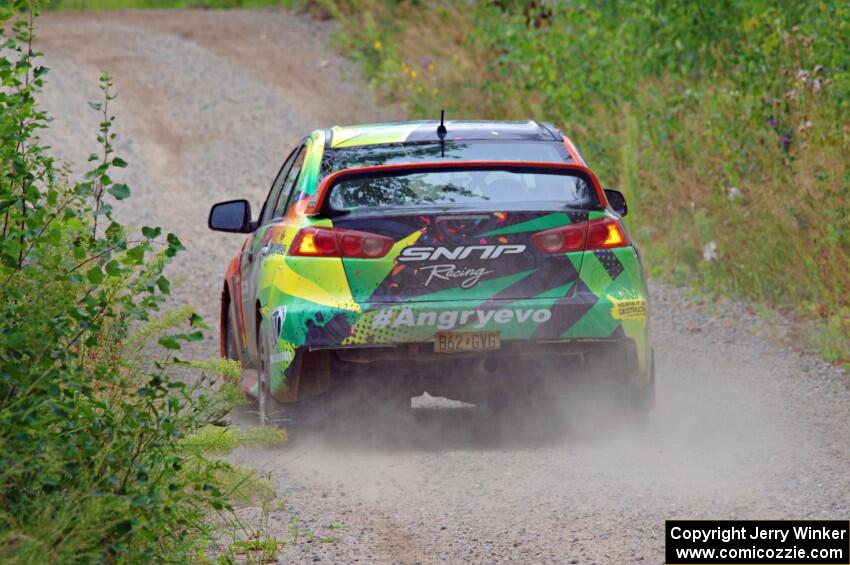 Sumit Panjabi / Nitan Jacob Mitsubishi Lancer Evo X limps through a sharp left on SS3, Steamboat I.