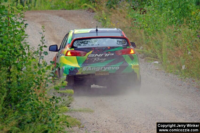 Sumit Panjabi / Nitan Jacob Mitsubishi Lancer Evo X limps through a sharp left on SS3, Steamboat I.