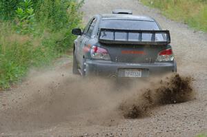 Sam Albert / Michelle Miller Subaru WRX STi at a sharp left on SS3, Steamboat I.