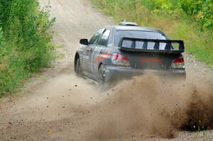 Sam Albert / Michelle Miller Subaru WRX STi at a sharp left on SS3, Steamboat I.