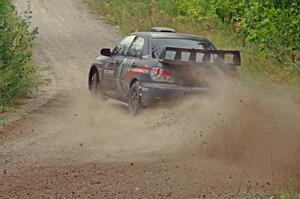 Sam Albert / Michelle Miller Subaru WRX STi at a sharp left on SS3, Steamboat I.