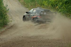 Sam Albert / Michelle Miller Subaru WRX STi at a sharp left on SS3, Steamboat I.