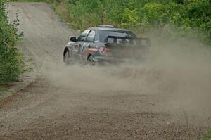 Sam Albert / Michelle Miller Subaru WRX STi at a sharp left on SS3, Steamboat I.