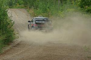 Sam Albert / Michelle Miller Subaru WRX STi at a sharp left on SS3, Steamboat I.