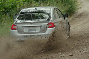 Travis Nease / Krista Skucas Subaru WRX STi at a sharp left on SS3, Steamboat I.