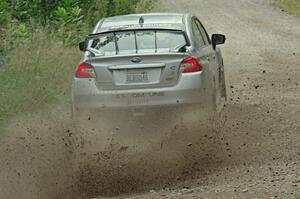 Travis Nease / Krista Skucas Subaru WRX STi at a sharp left on SS3, Steamboat I.