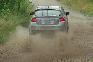 Travis Nease / Krista Skucas Subaru WRX STi at a sharp left on SS3, Steamboat I.