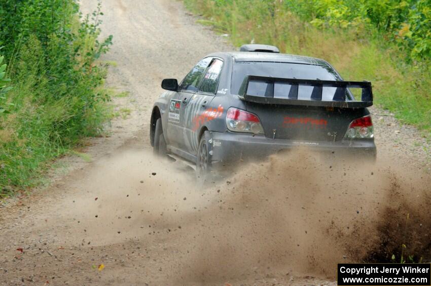 Sam Albert / Michelle Miller Subaru WRX STi at a sharp left on SS3, Steamboat I.