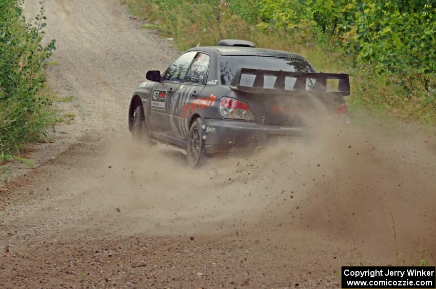 Sam Albert / Michelle Miller Subaru WRX STi at a sharp left on SS3, Steamboat I.