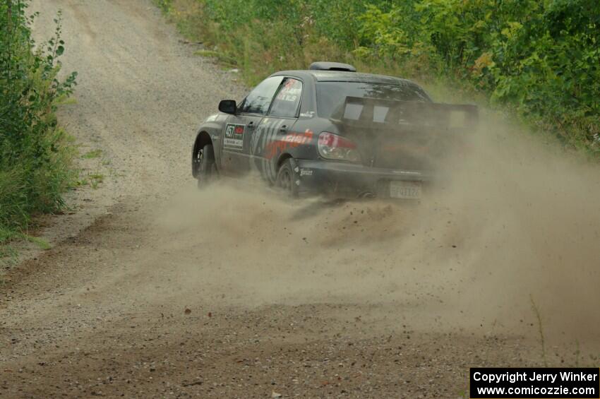 Sam Albert / Michelle Miller Subaru WRX STi at a sharp left on SS3, Steamboat I.