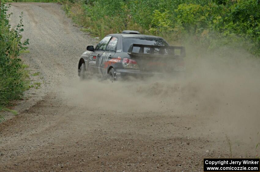 Sam Albert / Michelle Miller Subaru WRX STi at a sharp left on SS3, Steamboat I.