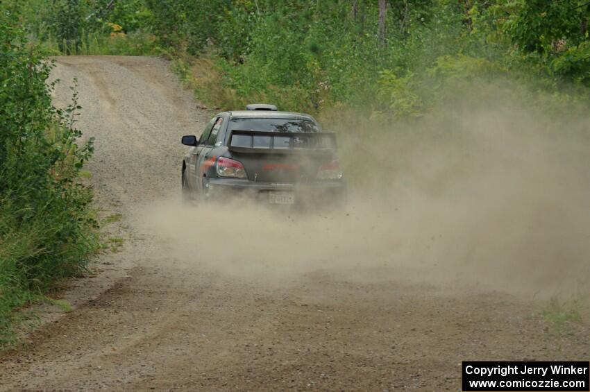 Sam Albert / Michelle Miller Subaru WRX STi at a sharp left on SS3, Steamboat I.