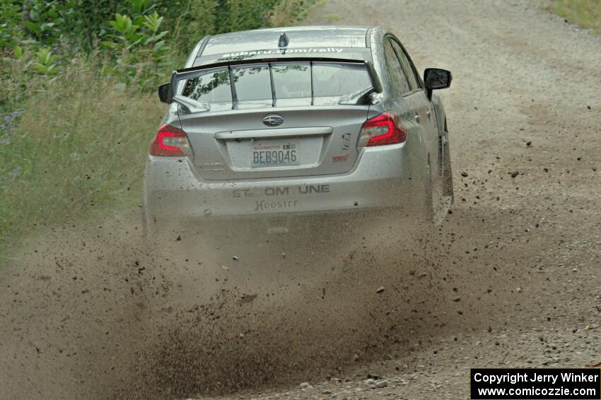 Travis Nease / Krista Skucas Subaru WRX STi at a sharp left on SS3, Steamboat I.