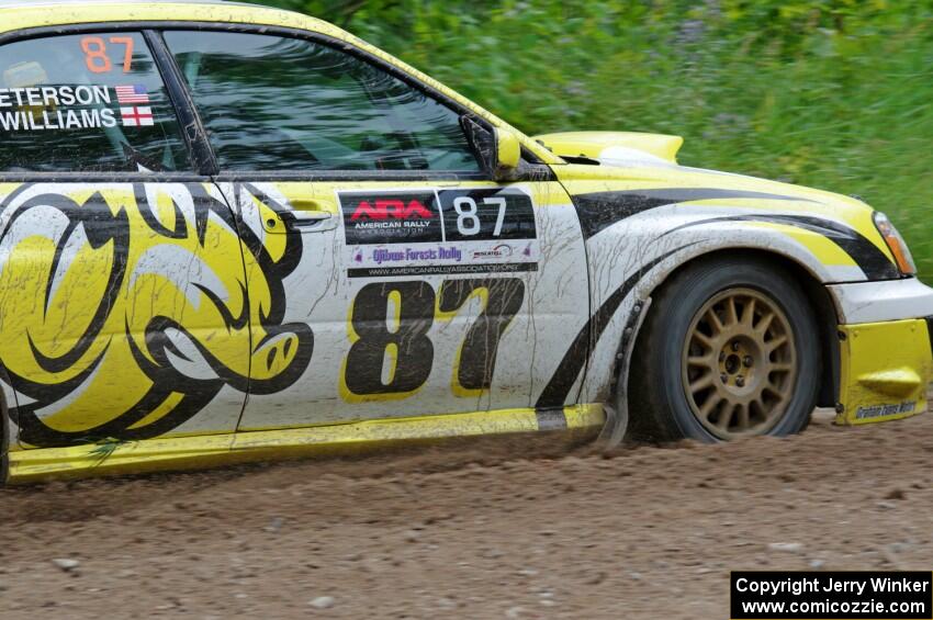 Mark Williams / Ben Peterson Subaru WRX STi at a sharp left on SS3, Steamboat I.