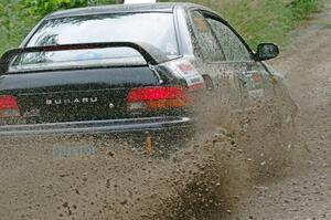 Kristian Rue / Mark Rue Subaru Impreza 2.5RS at a sharp left on SS3, Steamboat I.